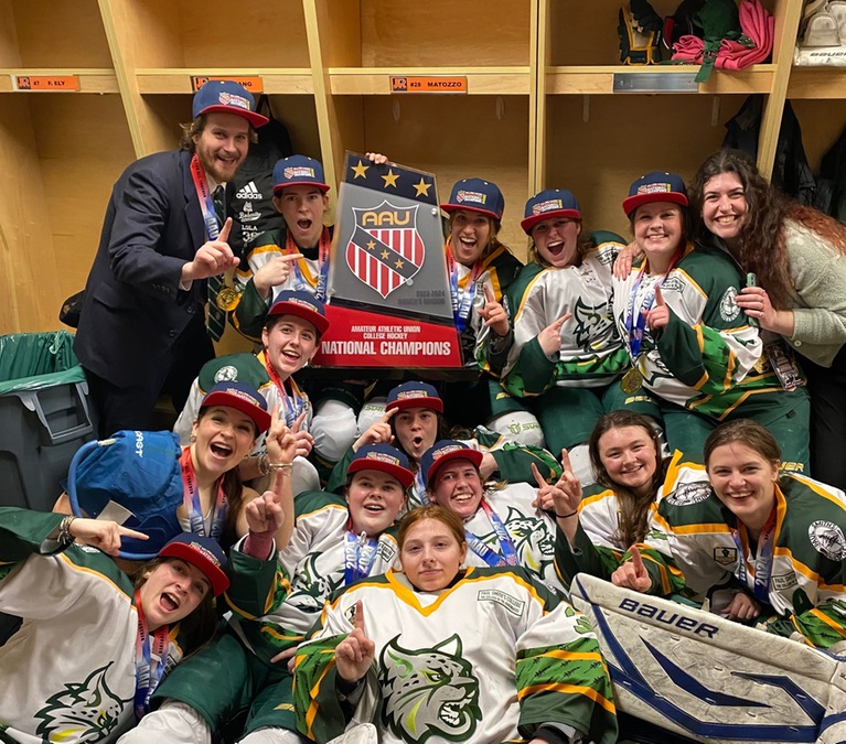 The Paul Smith's College women's hockey team celebrates after winning the 2024 AAU College Hockey Women's National Championship.