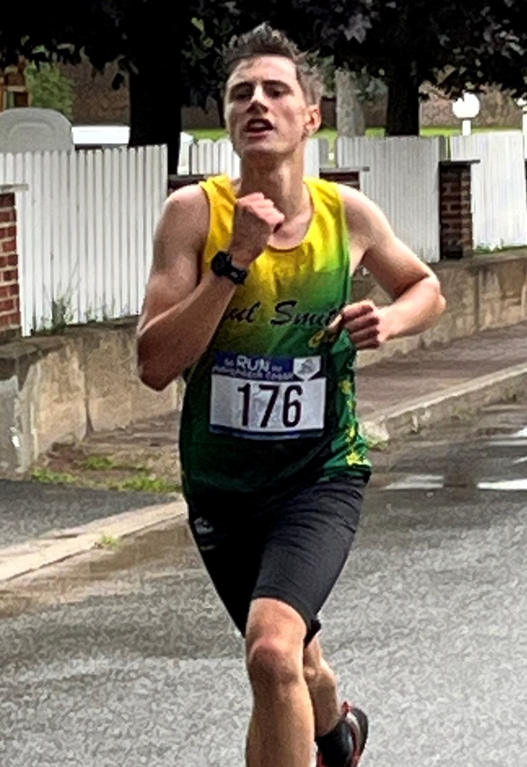 First Year Ethan Parrish heads to the 10K finish in the Olga Run in Saranac Lake, NY with a time of 35:31.