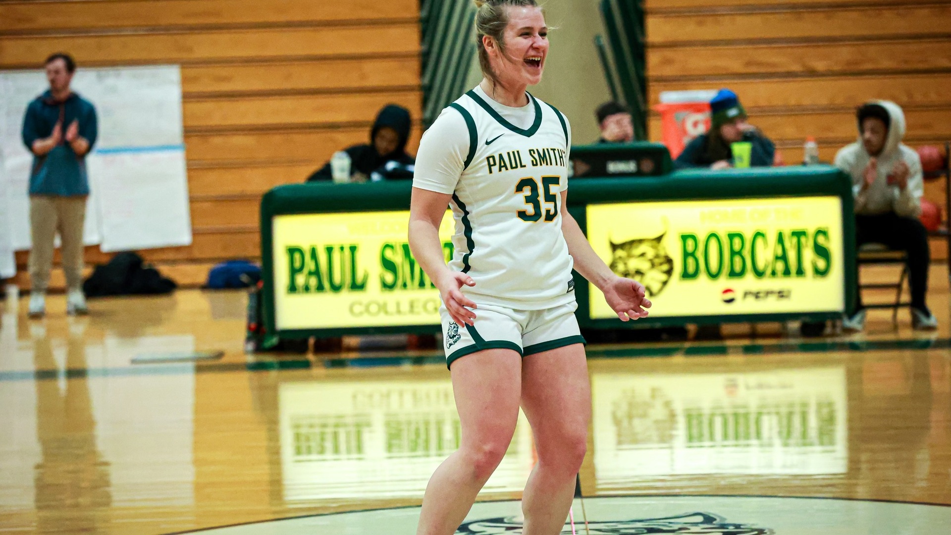 Hayleigh Gates celebrates after the Bobcats hit a three pointer in their game on Sunday vs. NHTI. (Mercedes Rideout photo) Thumbnail