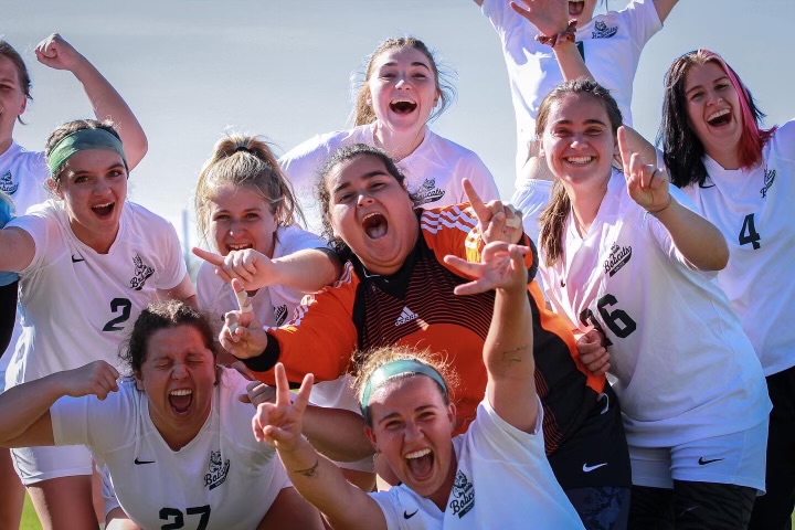 The Paul Smith's College women's soccer team celebrates after winning the YSCC Championship. Thumbnail